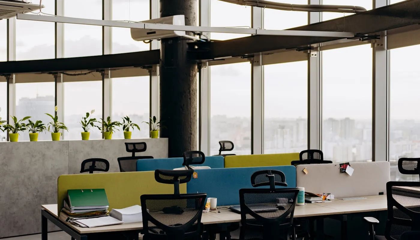 Spacious modern open office with large windows and city view