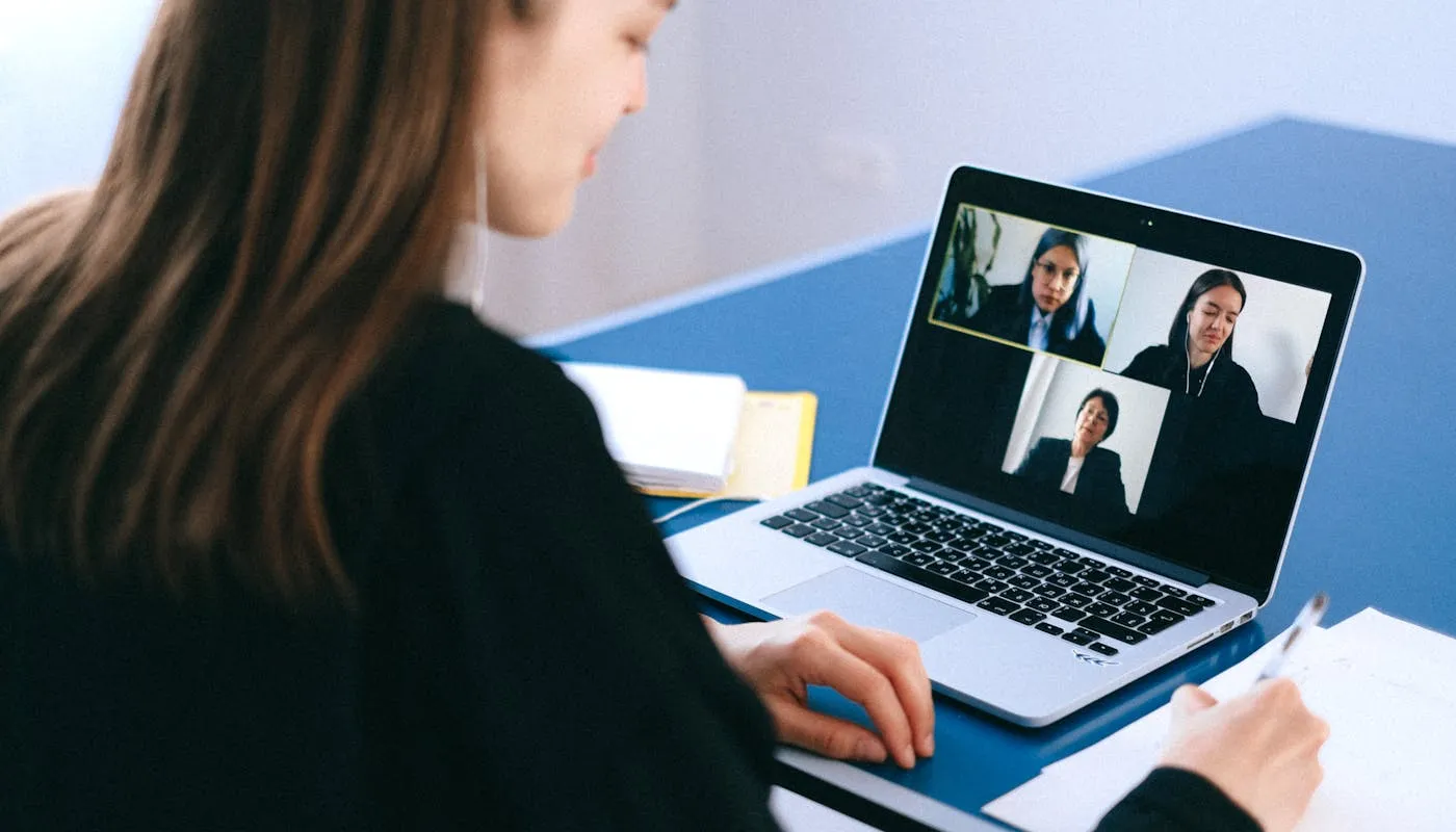 Professional conducting a video interview on laptop